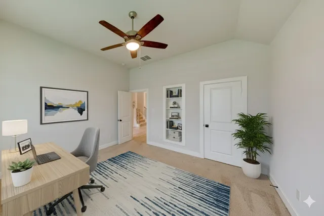 a view of a livingroom with a potted plant a ceiling fan and wooden floor