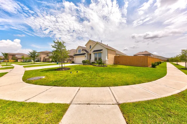 a view of yard with swimming pool and green space