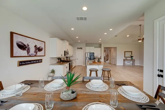 a living room with furniture kitchen and kitchen view