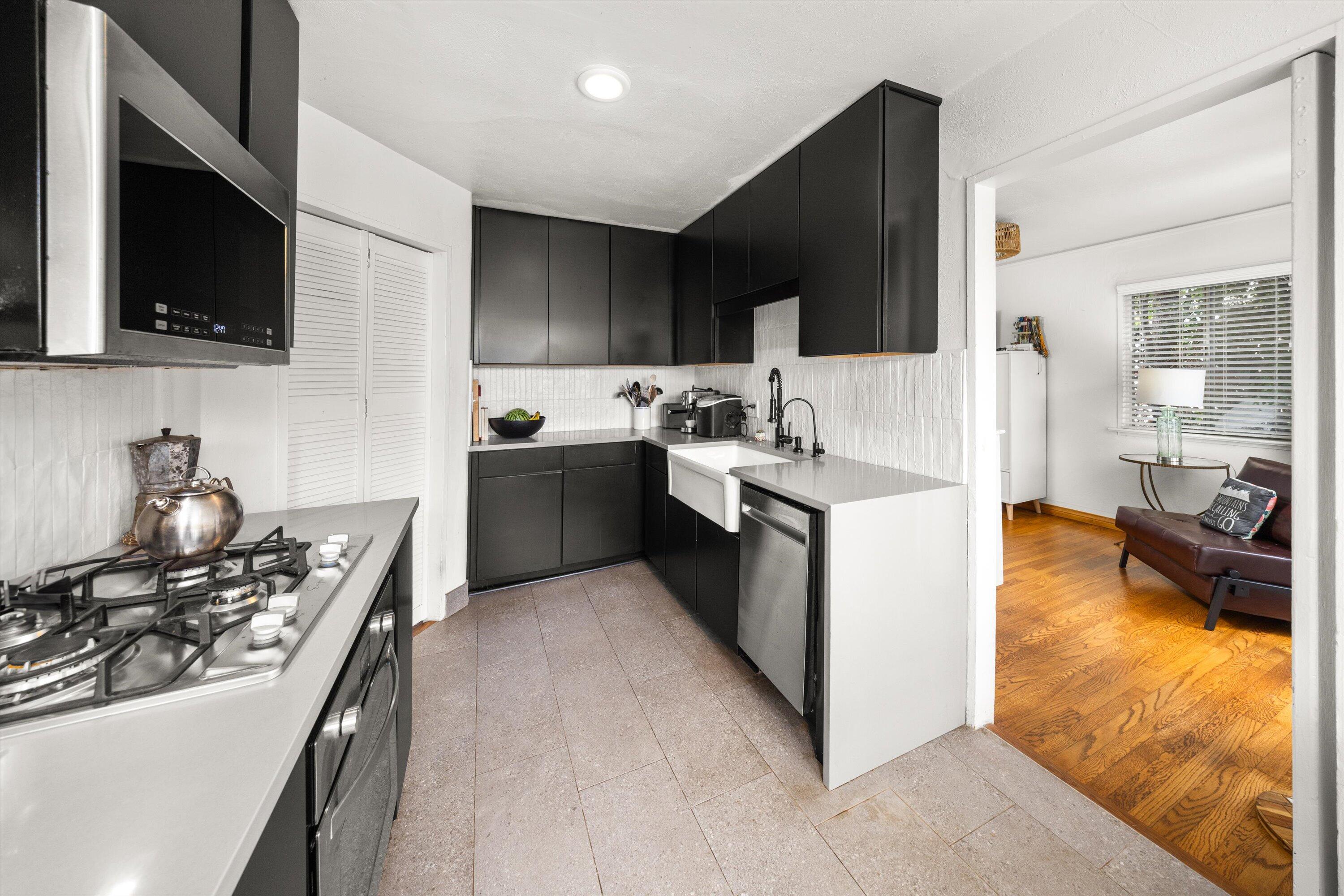 424 East Arrellaga Street Santa Barbara, CA 93101 - Photo 13 of 32 a kitchen with a sink stove and microwave