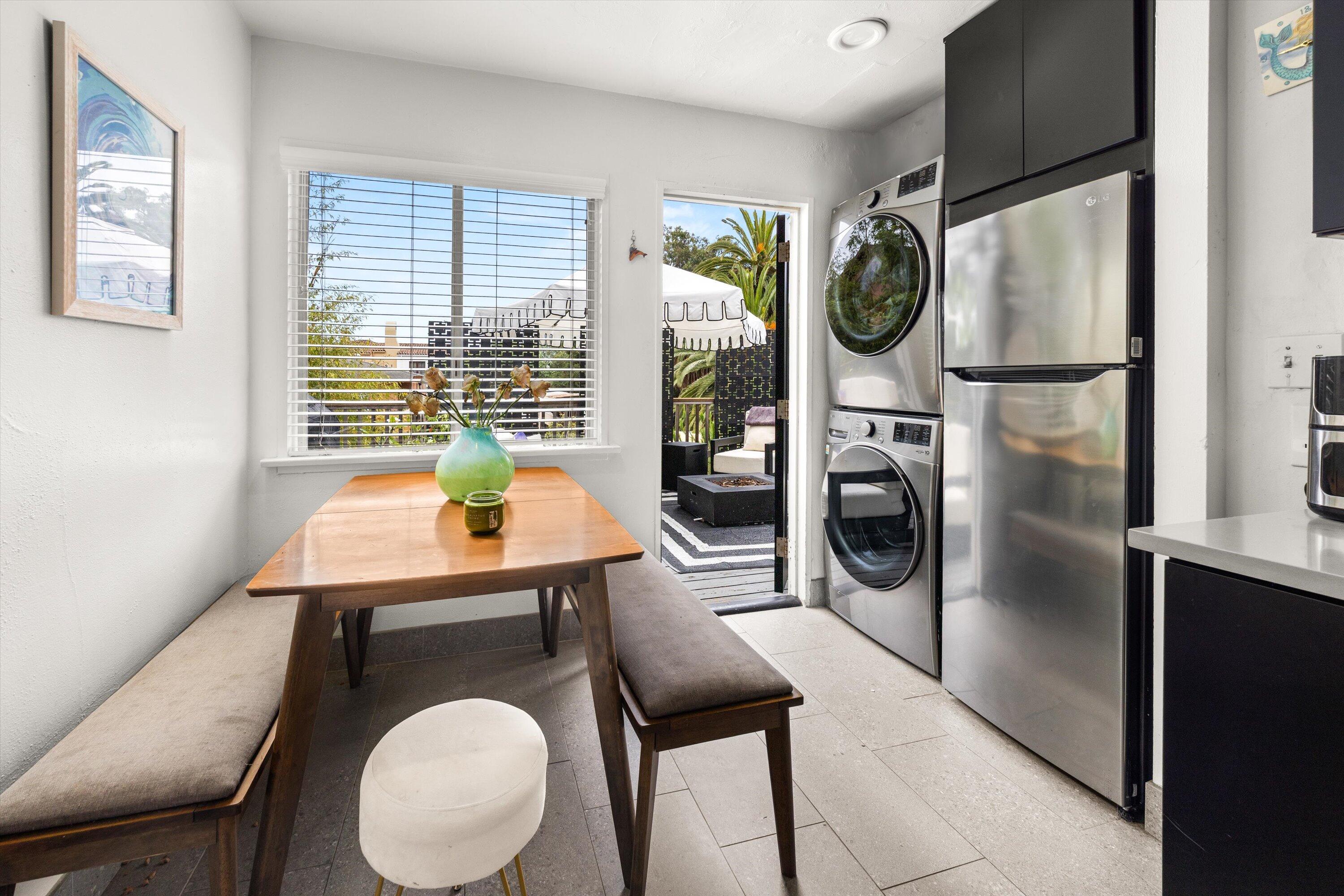424 East Arrellaga Street Santa Barbara, CA 93101 - Photo 15 of 32 a living room with furniture a window and a refrigerator