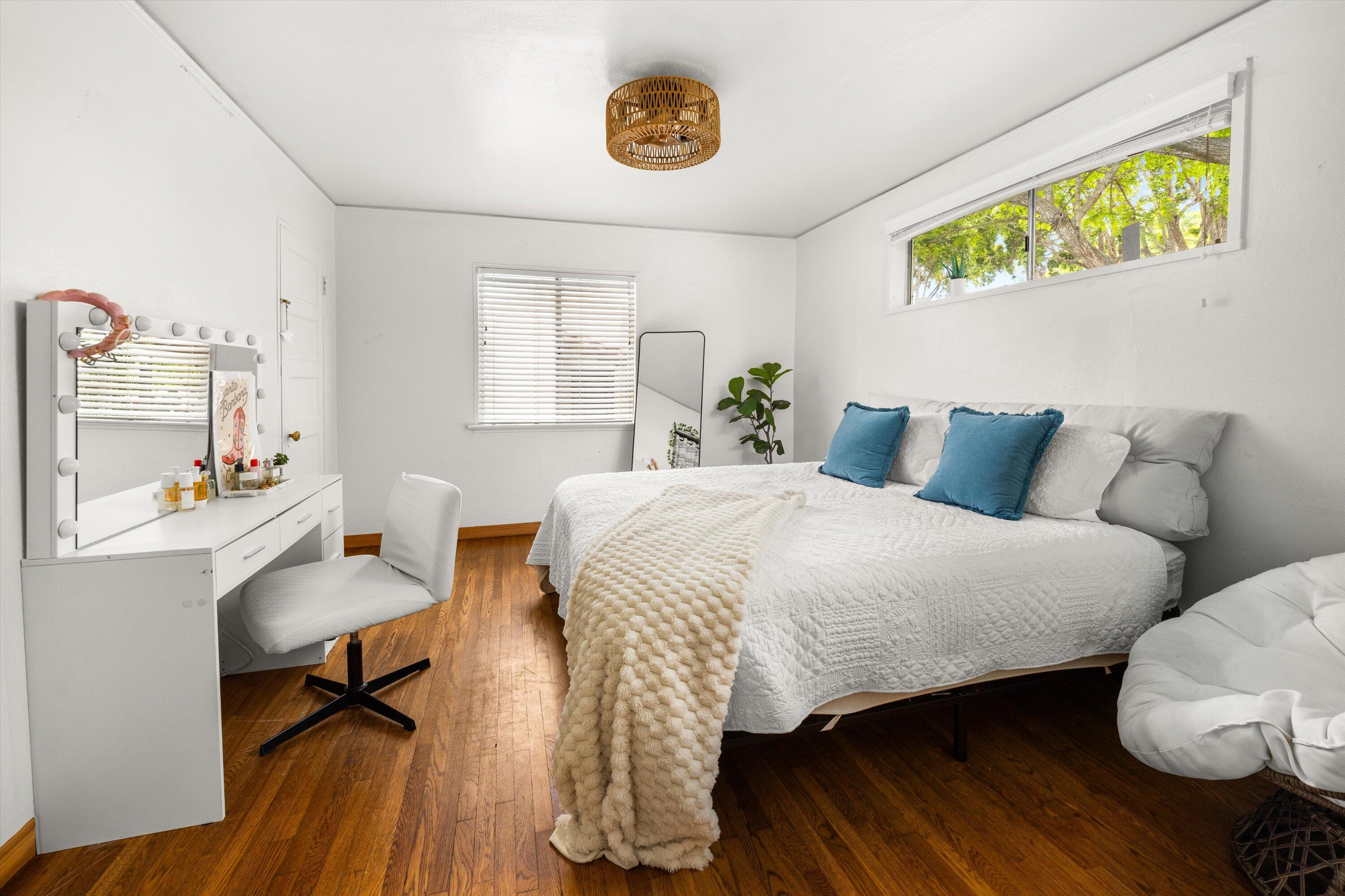 424 East Arrellaga Street Santa Barbara, CA 93101 - Photo 16 of 32 a bedroom with a bed and a table