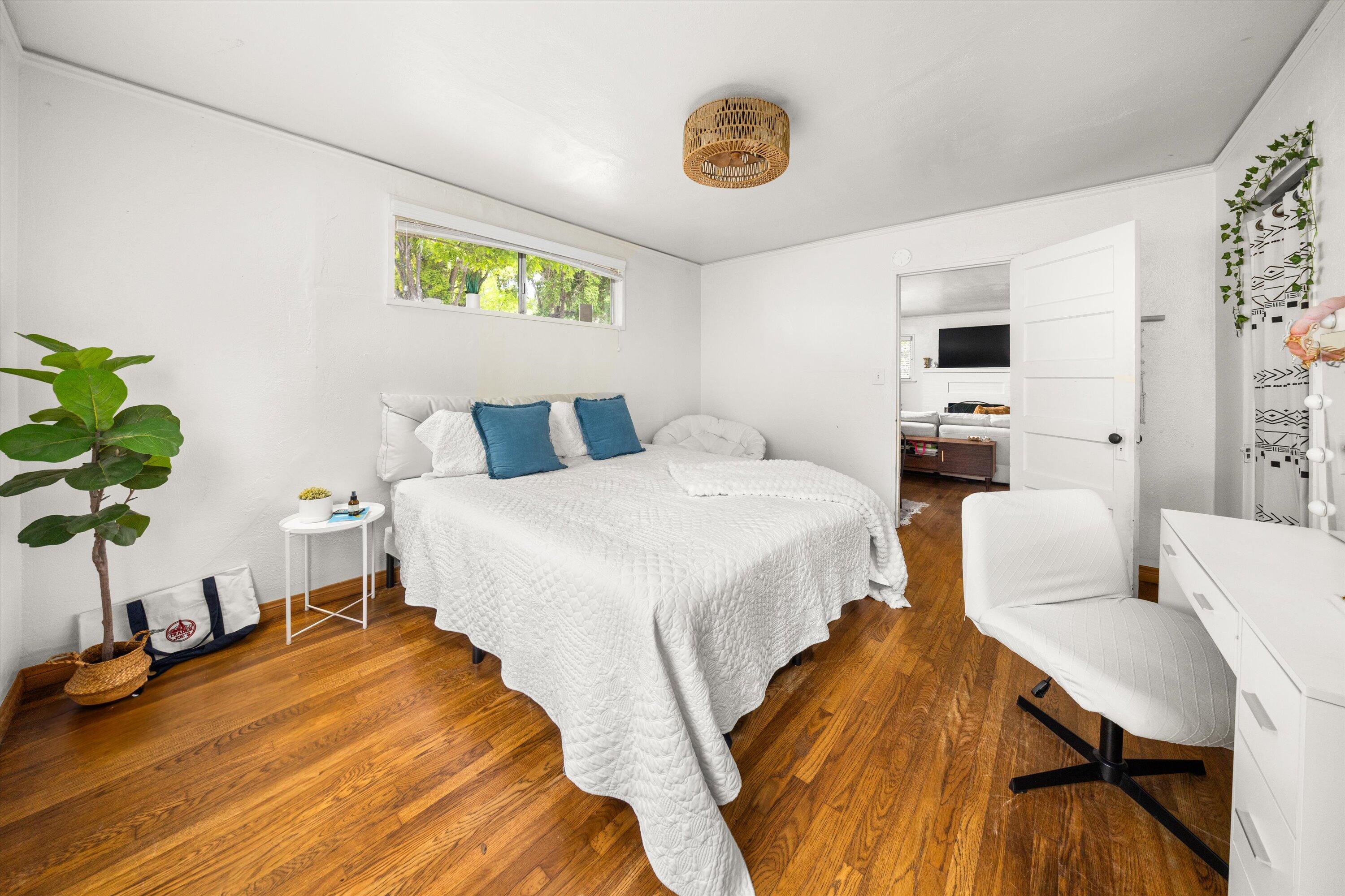 424 East Arrellaga Street Santa Barbara, CA 93101 - Photo 17 of 32 a bedroom with a bed and a potted plant