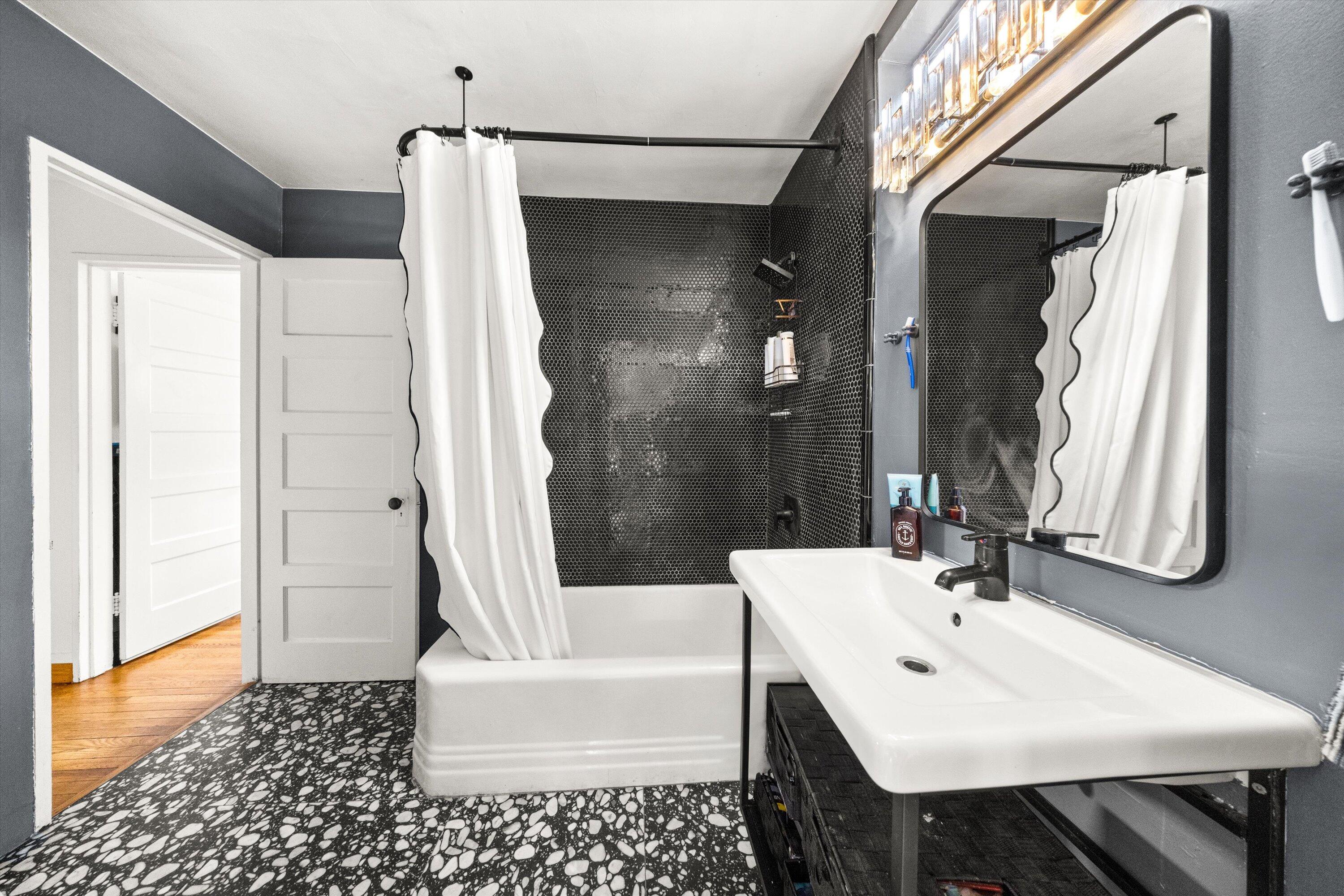 424 East Arrellaga Street Santa Barbara, CA 93101 - Photo 18 of 32 a bathroom with a sink a toilet and shower