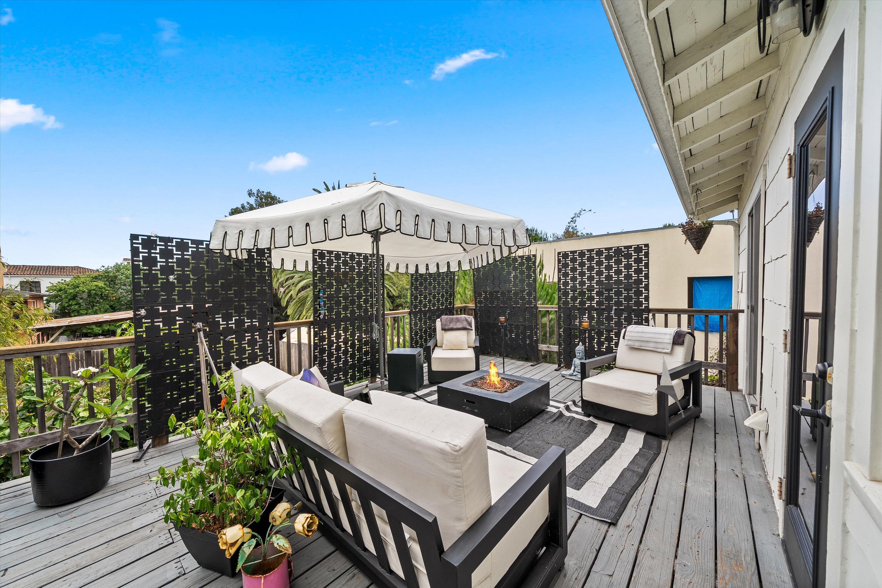 424 East Arrellaga Street Santa Barbara, CA 93101 - Photo 20 of 32 a view of a patio with couches potted plants and wooden floor