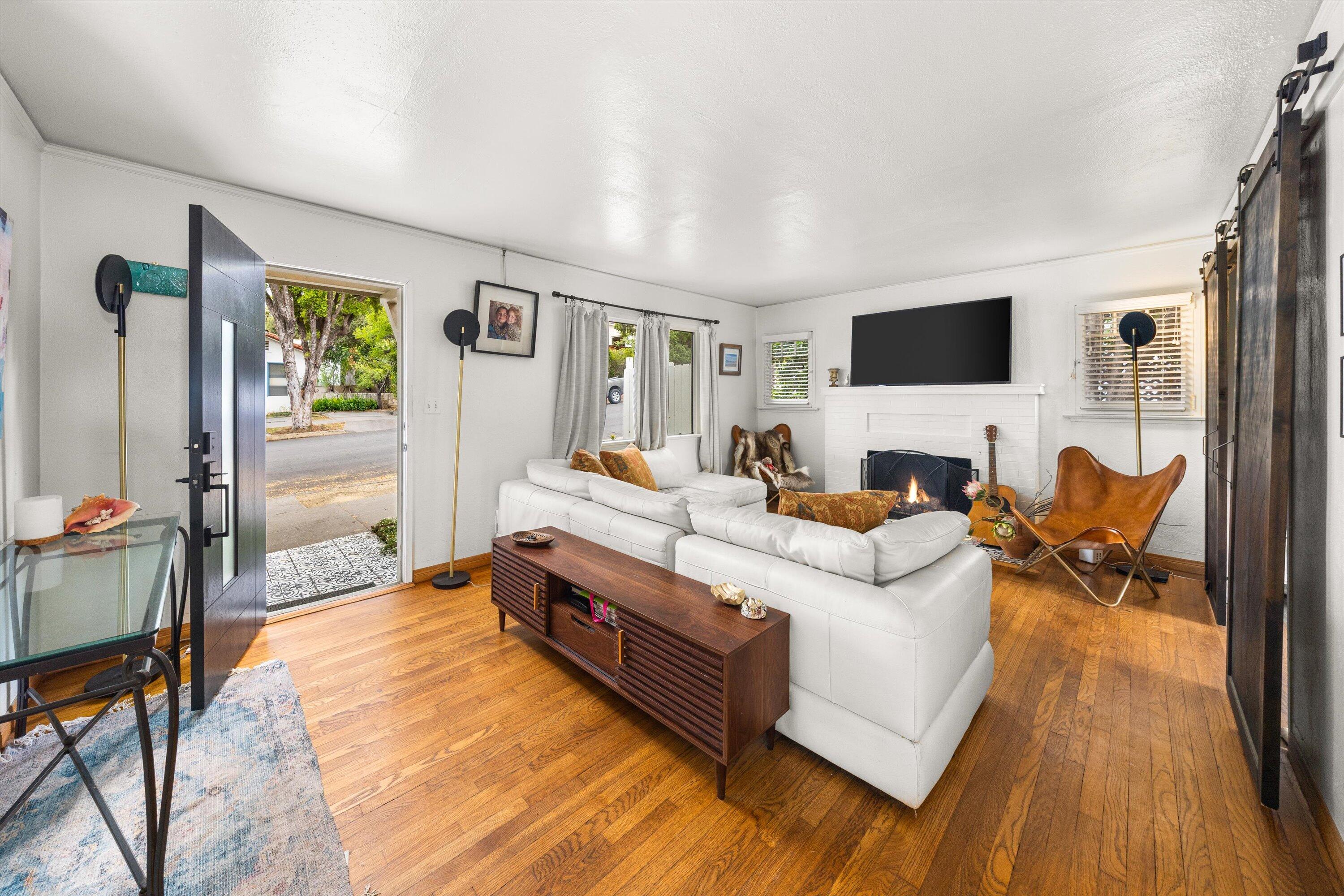 424 East Arrellaga Street Santa Barbara, CA 93101 - Photo 4 of 32 a living room with furniture and a flat screen tv