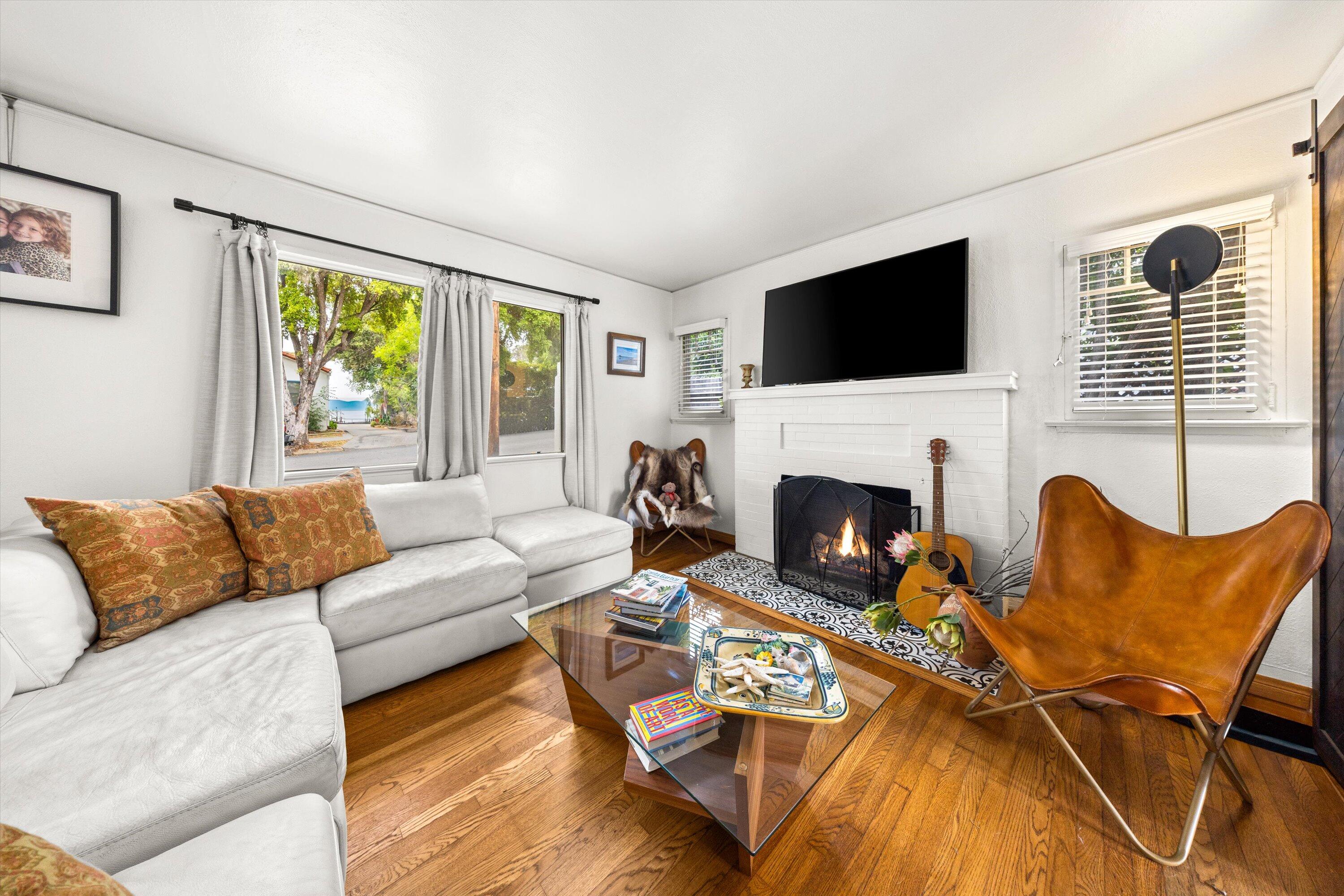 424 East Arrellaga Street Santa Barbara, CA 93101 - Photo 7 of 32 a living room with furniture fireplace and window