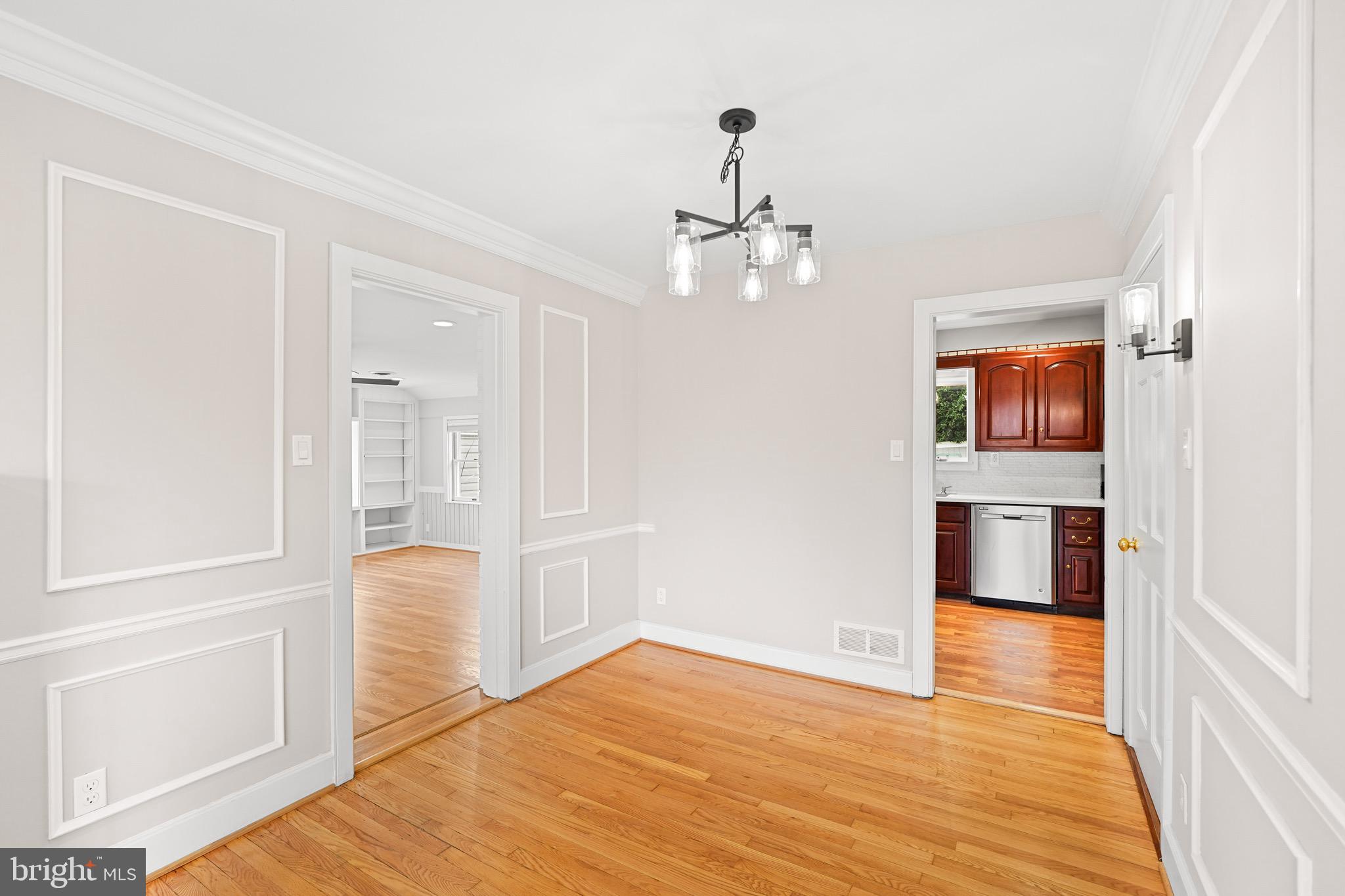 1600 Oaklawn Court Silver Spring, MD 20903 - Photo 13 of 62 wooden floor in an empty room with a window