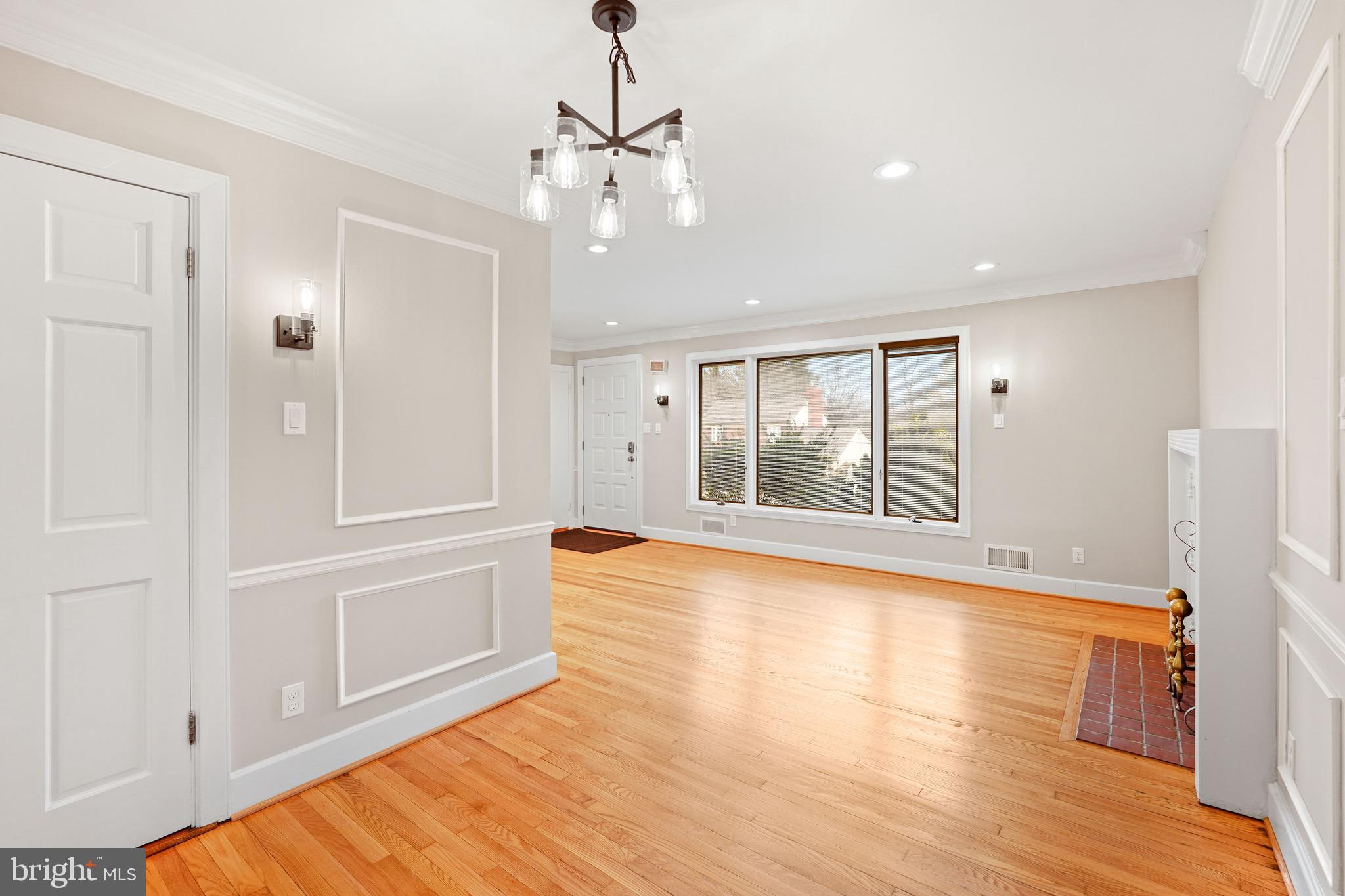 1600 Oaklawn Court Silver Spring, MD 20903 - Photo 14 of 62 a view of an empty room with wooden floor and a window