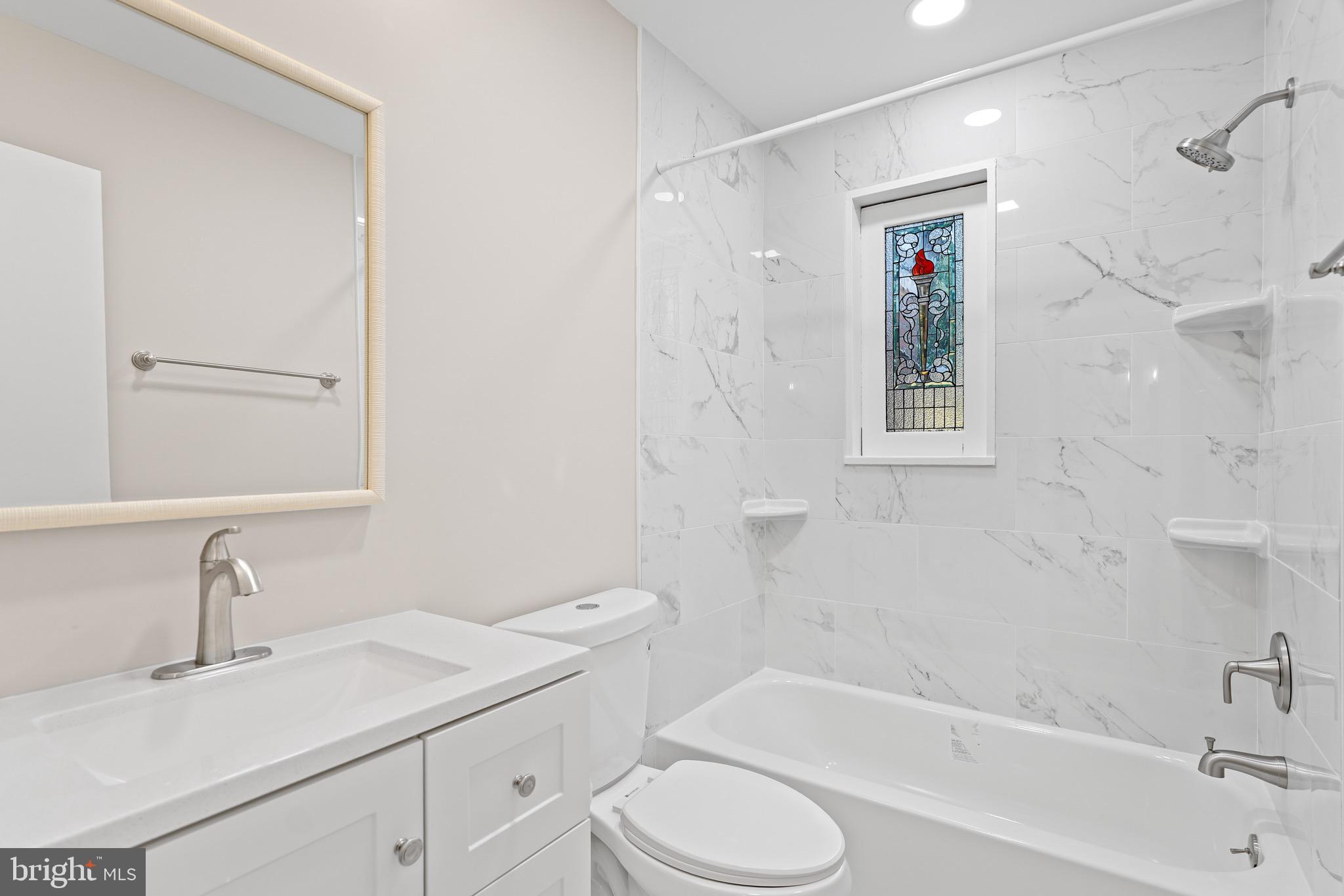 1600 Oaklawn Court Silver Spring, MD 20903 - Photo 24 of 62 a bathroom with a sink toilet and shower