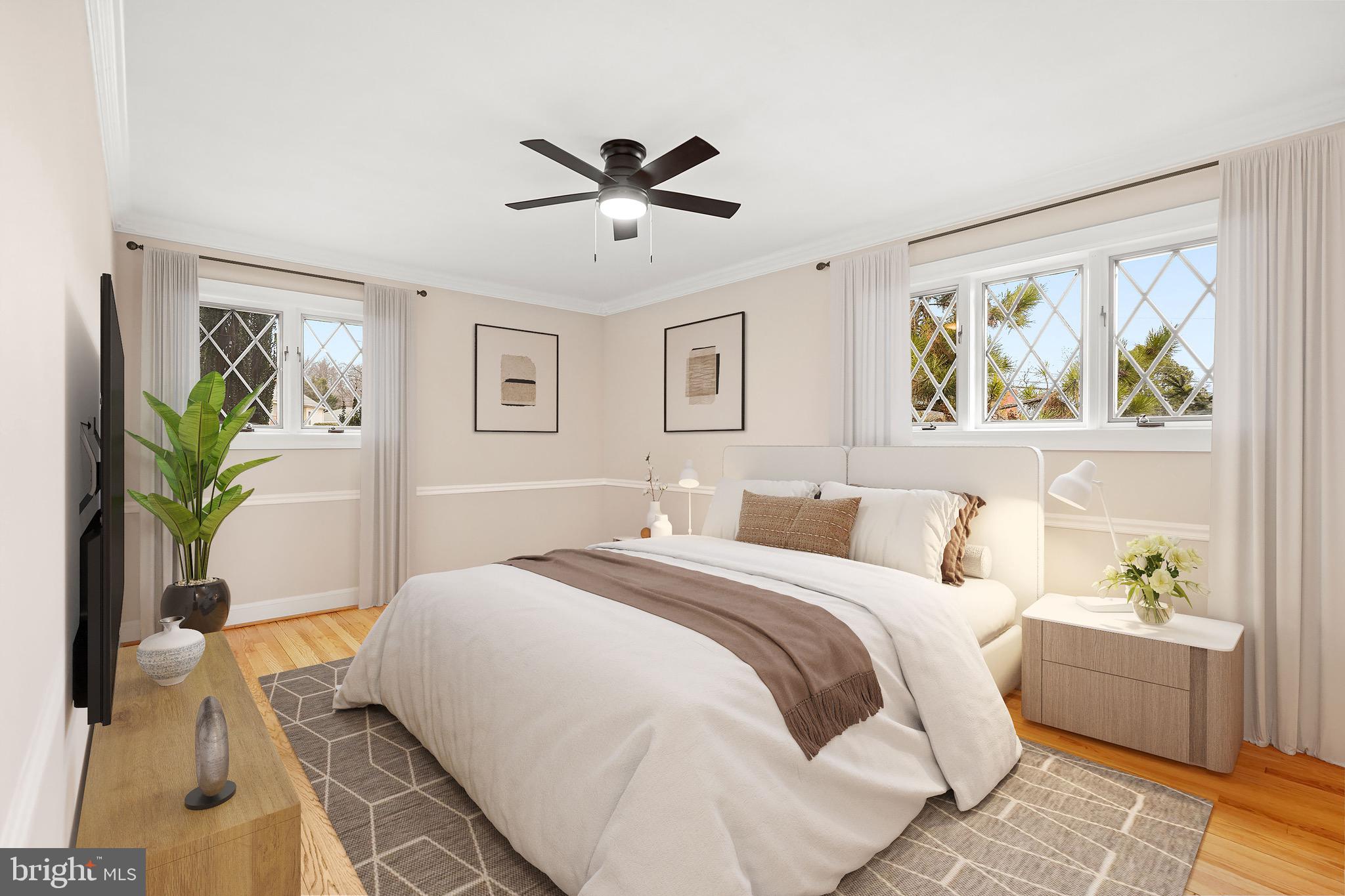 1600 Oaklawn Court Silver Spring, MD 20903 - Photo 28 of 62 a bedroom with a large bed and a potted plant