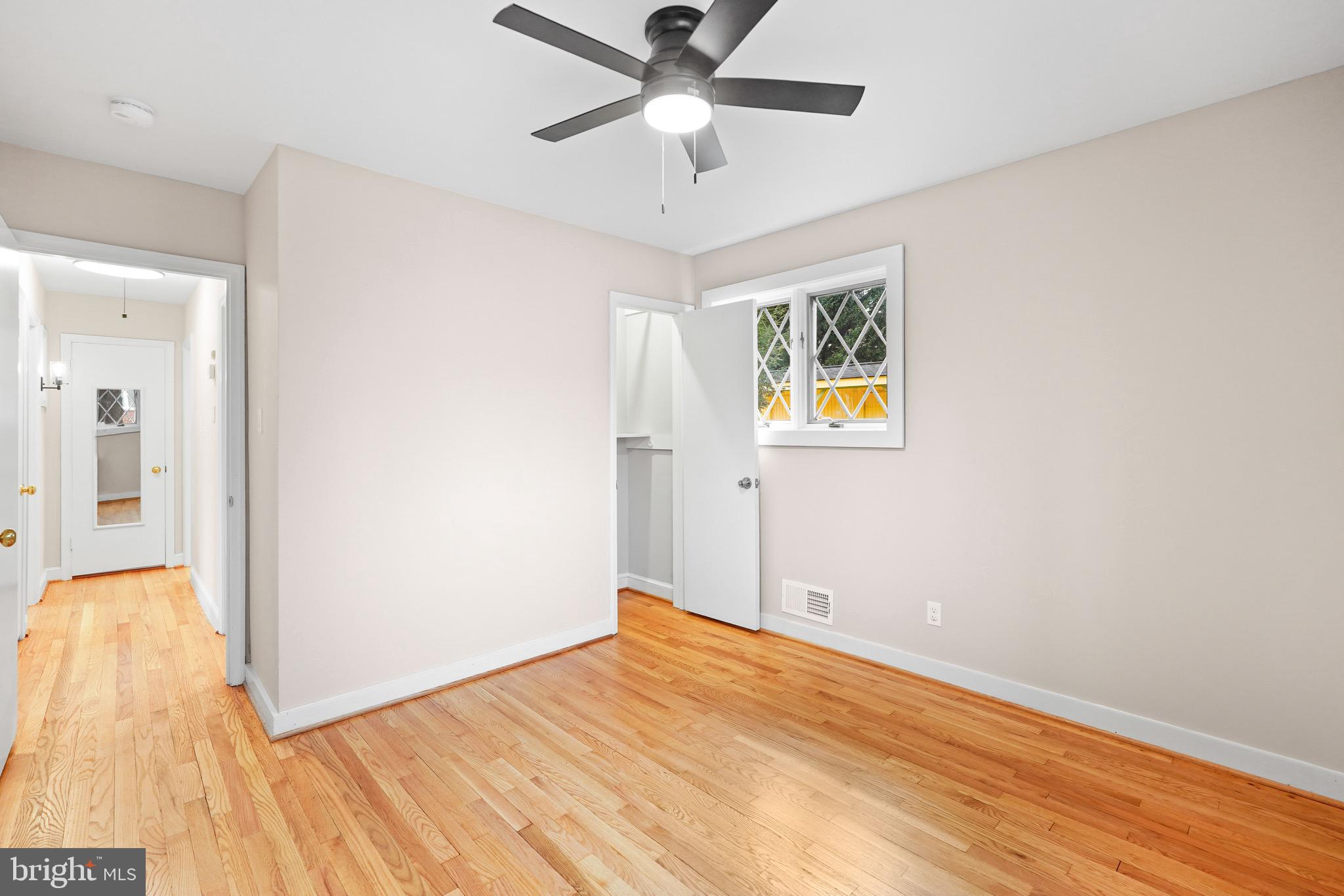 1600 Oaklawn Court Silver Spring, MD 20903 - Photo 30 of 62 a view of an empty room with window and wooden floor