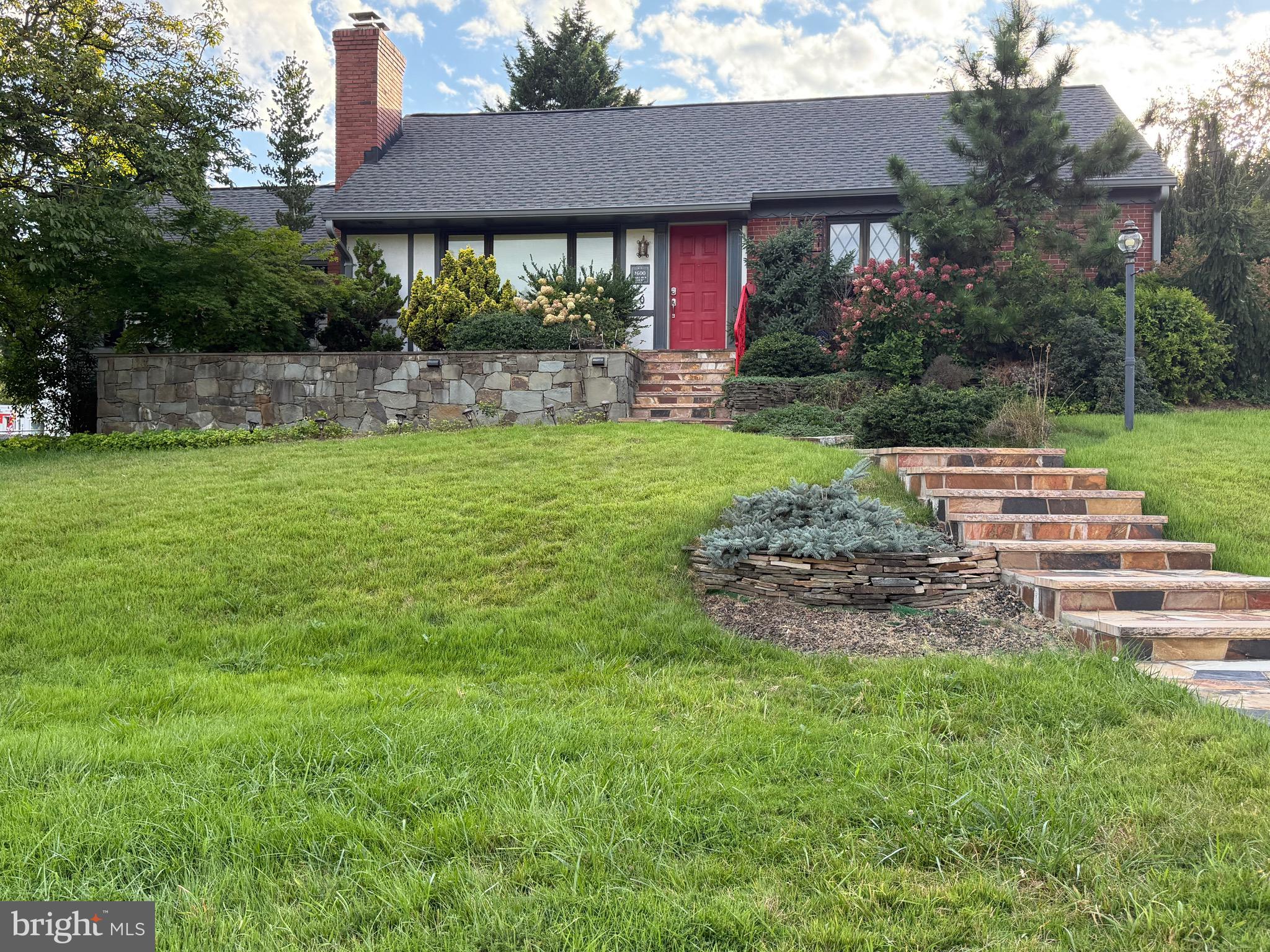 1600 Oaklawn Court Silver Spring, MD 20903 - Photo 3 of 62 a front view of a house with a yard