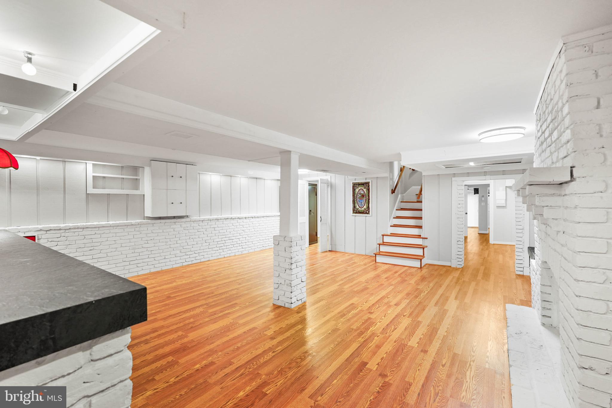 1600 Oaklawn Court Silver Spring, MD 20903 - Photo 36 of 62 a view of a room with wooden floor and staircase