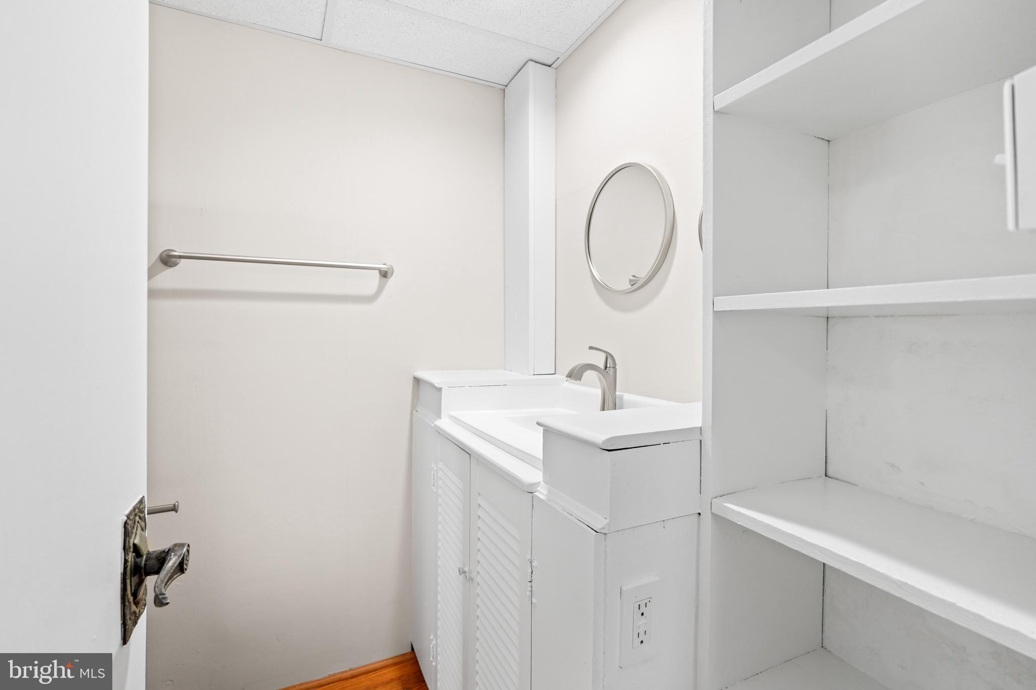 1600 Oaklawn Court Silver Spring, MD 20903 - Photo 43 of 62 a bathroom with a sink and a mirror
