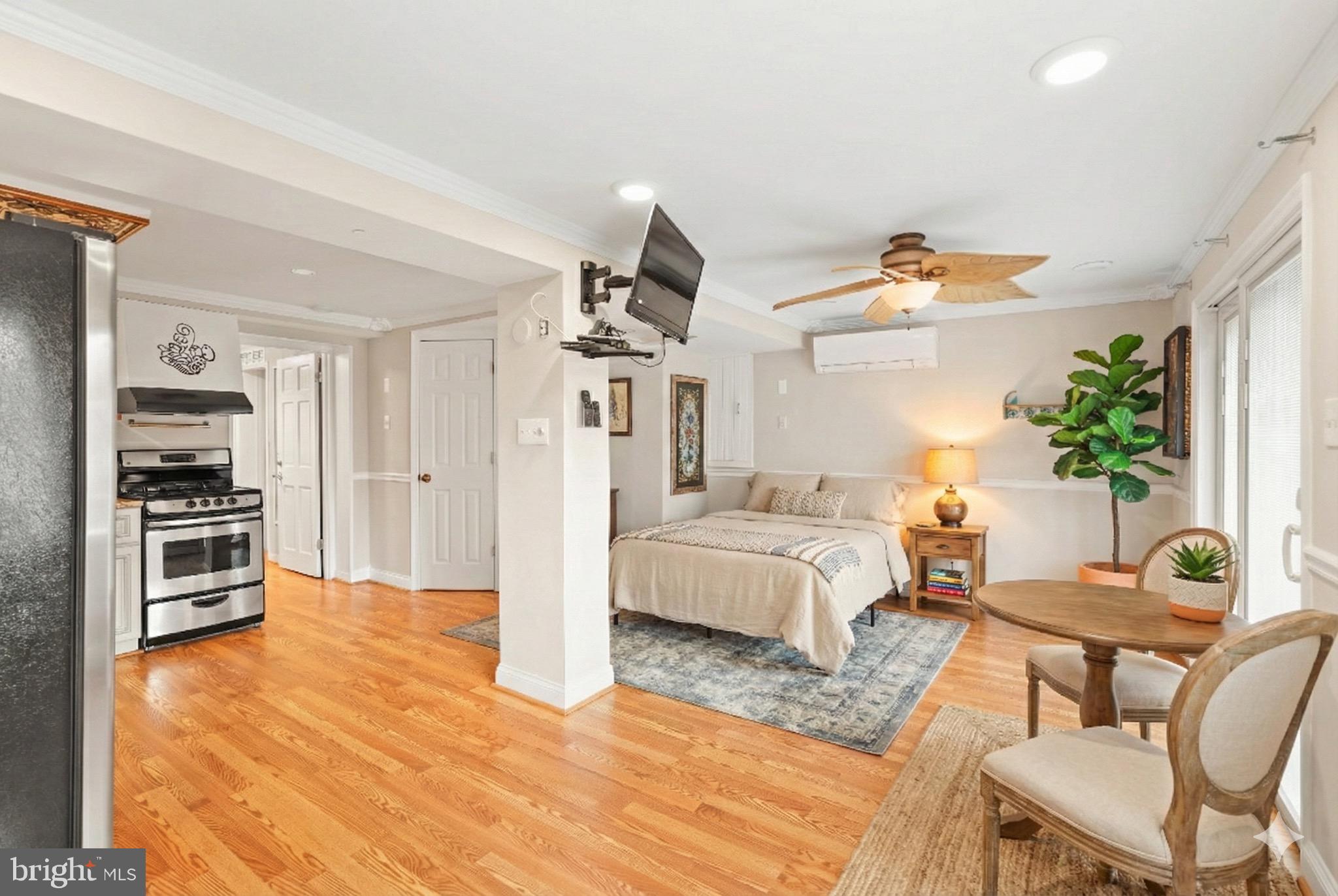1600 Oaklawn Court Silver Spring, MD 20903 - Photo 46 of 62 a living room with furniture and a kitchen area