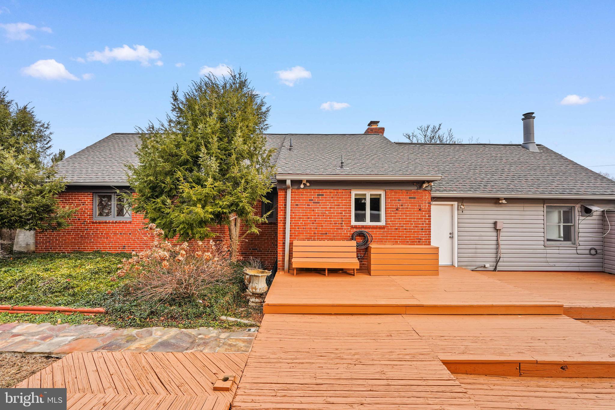 1600 Oaklawn Court Silver Spring, MD 20903 - Photo 56 of 62 a front view of a house with a yard and garage