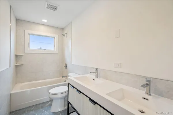 a bathroom with a sink and a bathtub