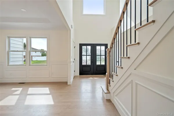 a view of staircase with white walls and a window