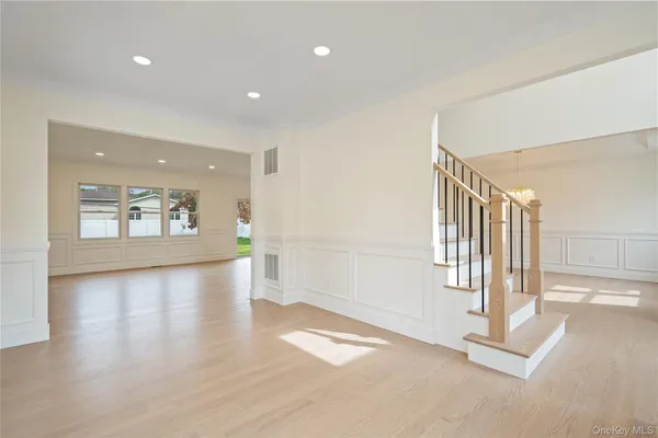 a view of an entryway with wooden floor