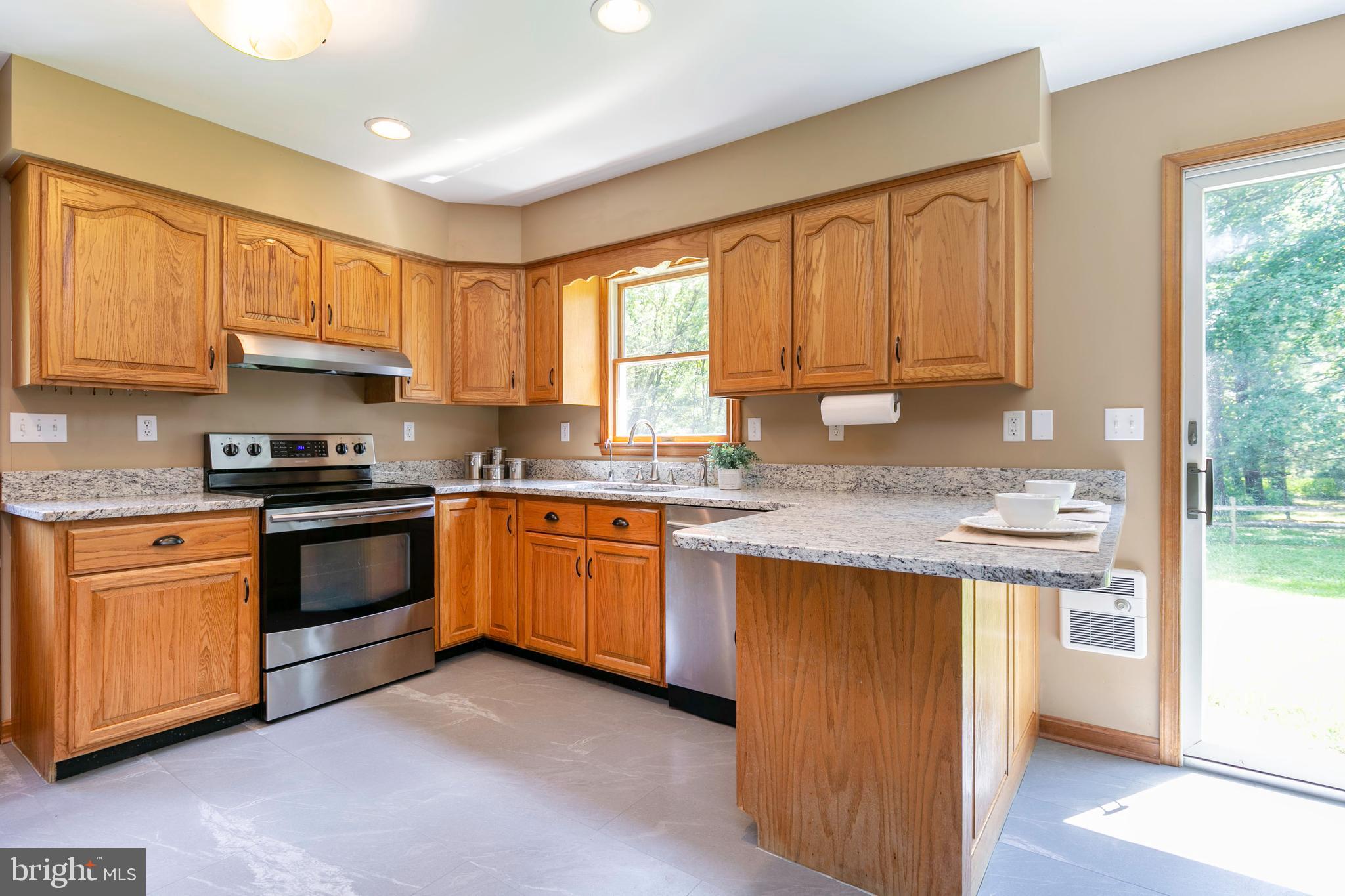 215 Roe Road Barclay, MD 21607 - Photo 6 of 49 Solid wood cabinets with updated hardware.