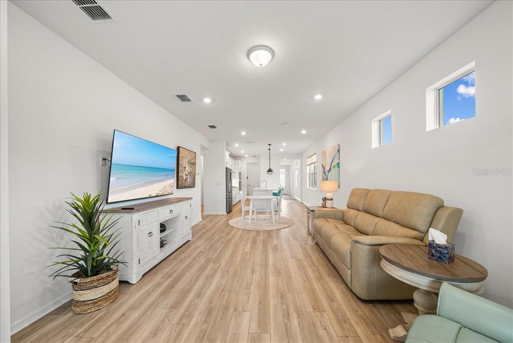 9434 Ballaster Pointe Loop Palmetto, FL 34221 - Photo 23 of 66 a living room with furniture and a flat screen tv