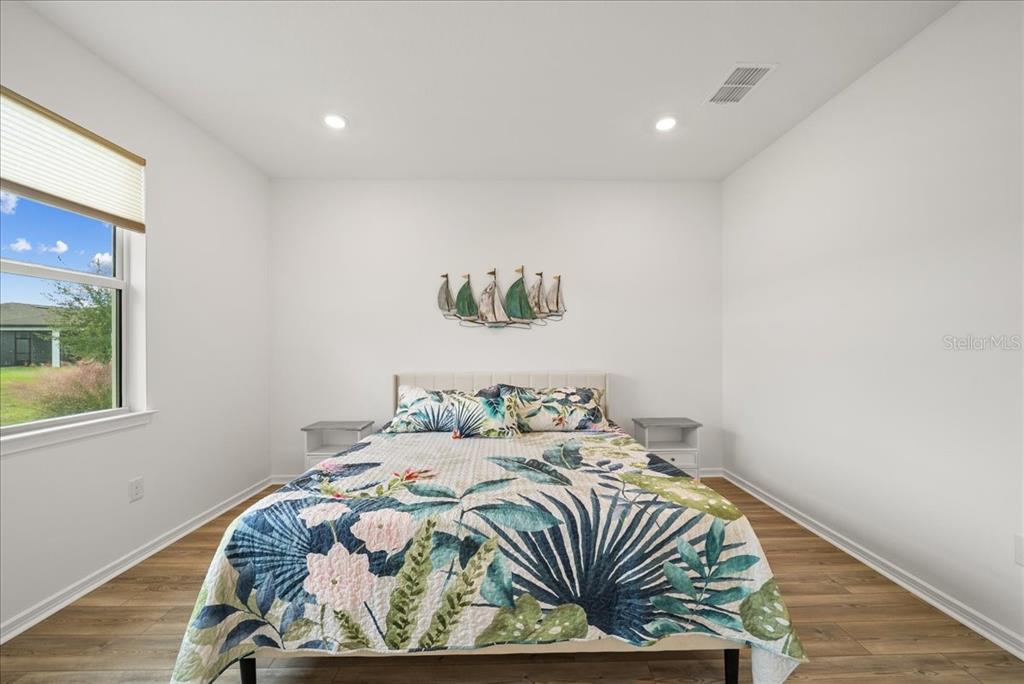 9434 Ballaster Pointe Loop Palmetto, FL 34221 - Photo 26 of 66 a bedroom with a bed and a window