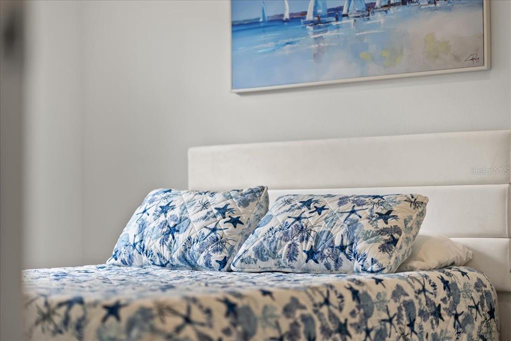 9434 Ballaster Pointe Loop Palmetto, FL 34221 - Photo 32 of 66 a bed sitting in a bedroom next to a window