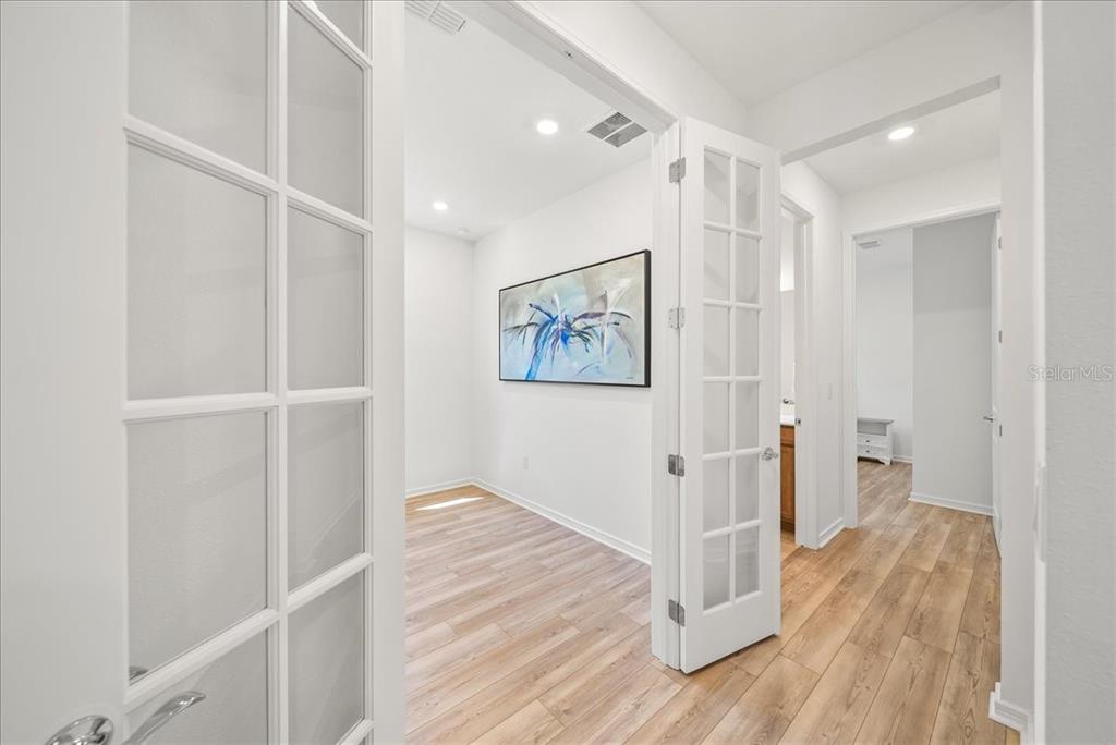 9434 Ballaster Pointe Loop Palmetto, FL 34221 - Photo 38 of 66 a view of a hallway with wooden floor