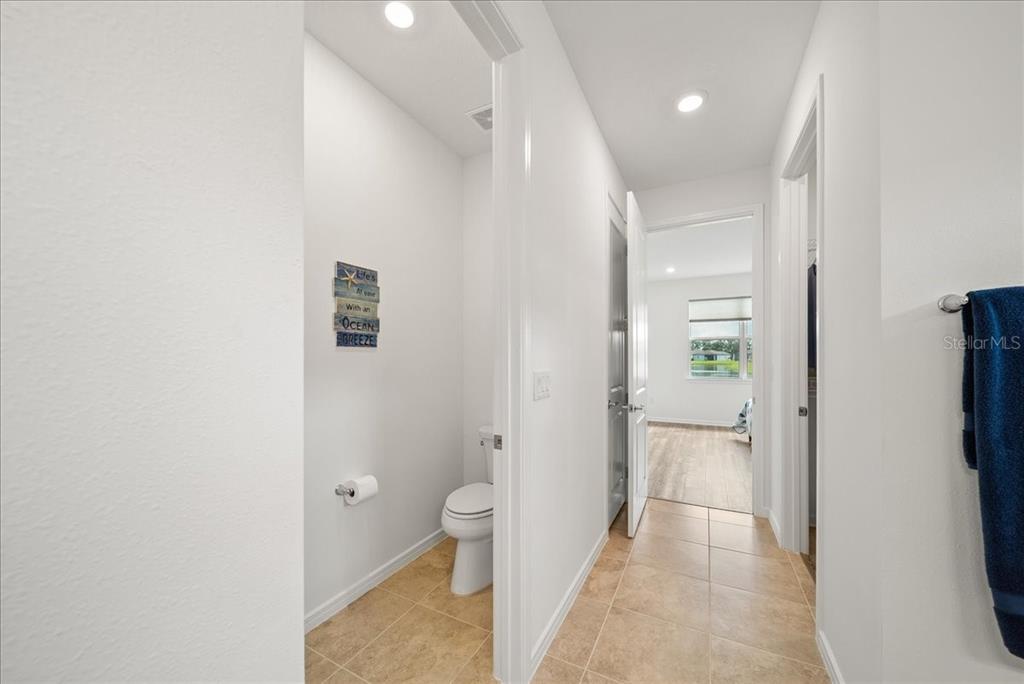 9434 Ballaster Pointe Loop Palmetto, FL 34221 - Photo 39 of 66 a bathroom with a toilet sink and shower