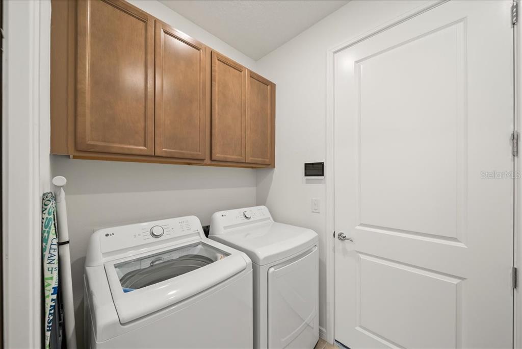 9434 Ballaster Pointe Loop Palmetto, FL 34221 - Photo 41 of 66 a view of storage and utility room with washer and dryer