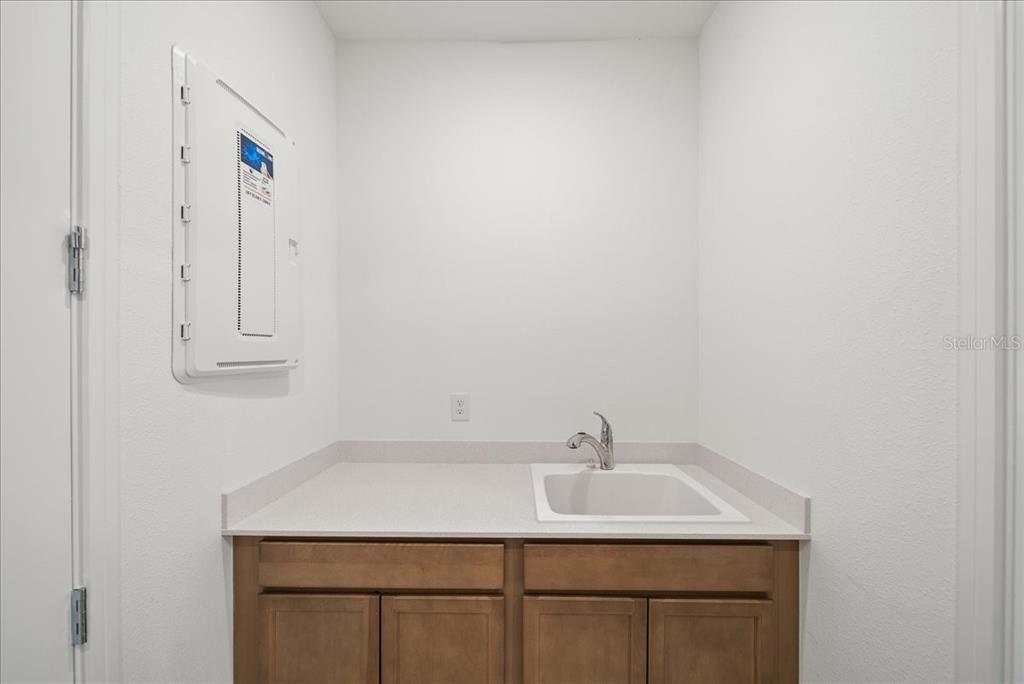 9434 Ballaster Pointe Loop Palmetto, FL 34221 - Photo 42 of 66 a bathroom with a sink and a mirror