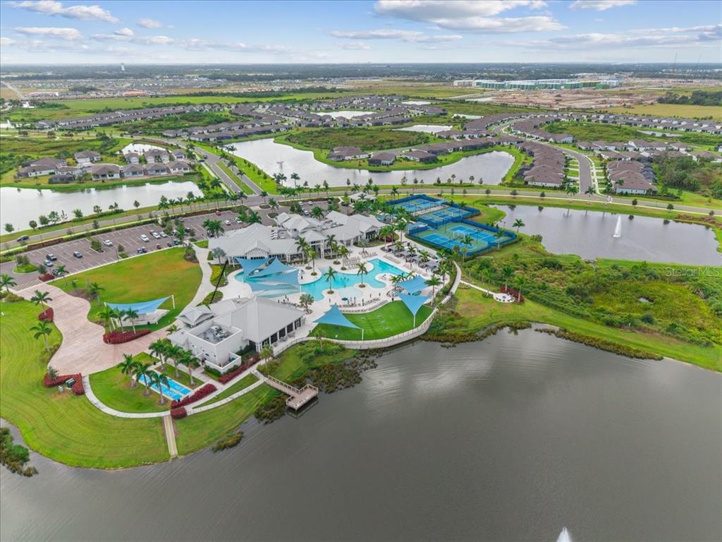 9434 Ballaster Pointe Loop Palmetto, FL 34221 - Photo 50 of 66 an aerial view of a residential houses with outdoor space