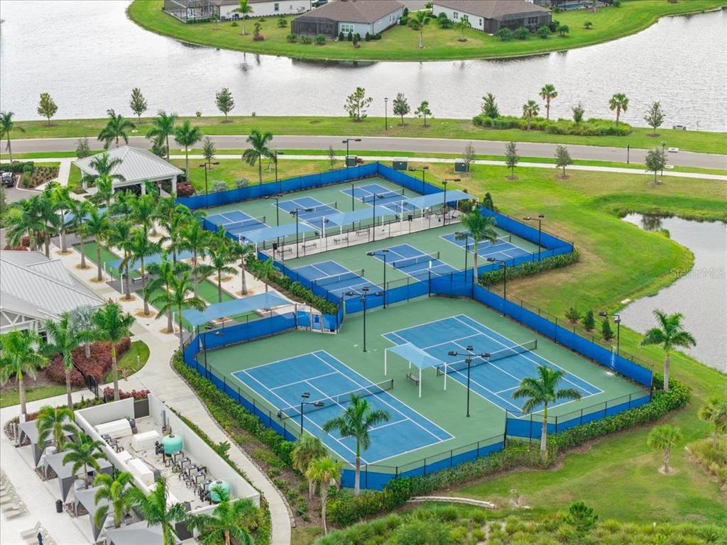 9434 Ballaster Pointe Loop Palmetto, FL 34221 - Photo 51 of 66 an aerial view of a house with a garden and lake view