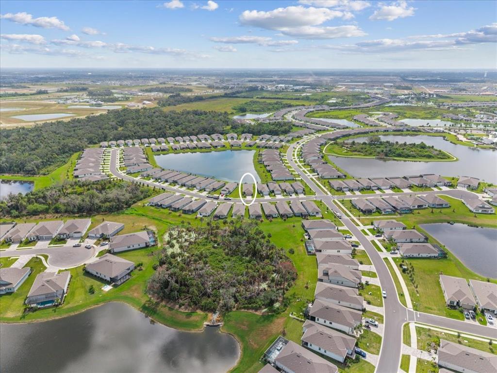 9434 Ballaster Pointe Loop Palmetto, FL 34221 - Photo 56 of 66 a view of a city with an ocean