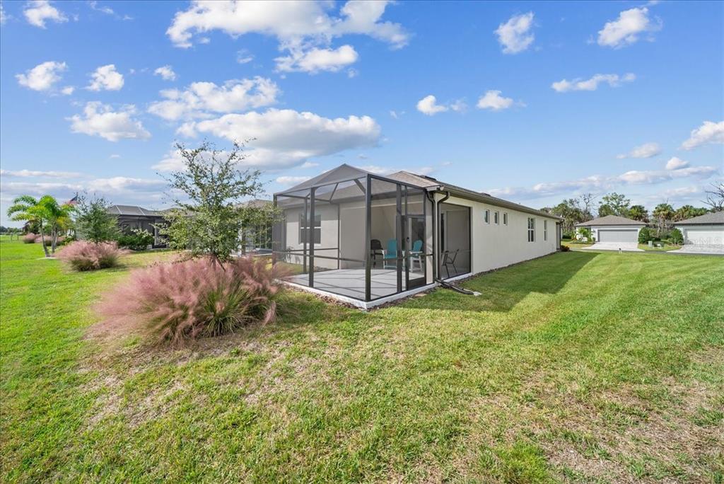 9434 Ballaster Pointe Loop Palmetto, FL 34221 - Photo 65 of 66 a view of a backyard with garden