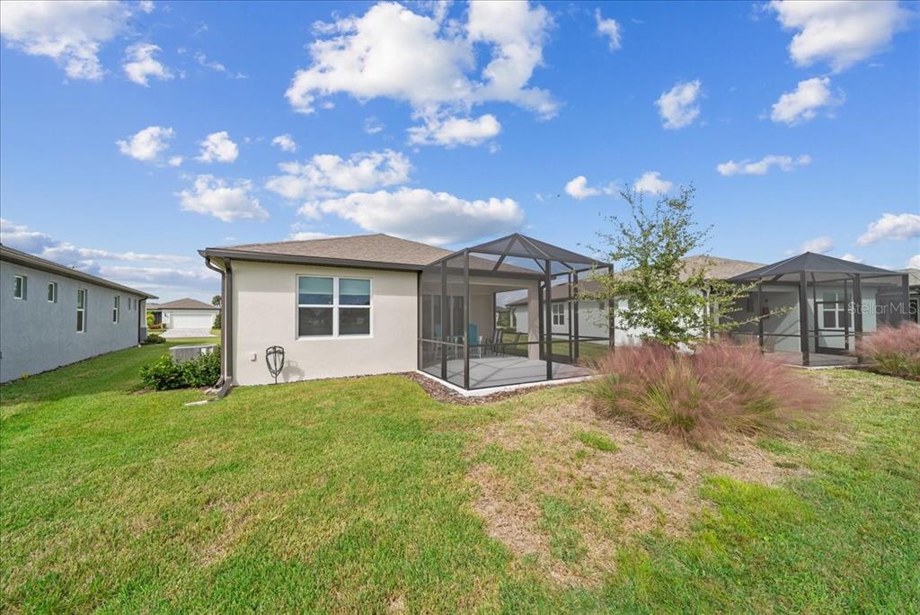 9434 Ballaster Pointe Loop Palmetto, FL 34221 - Photo 66 of 66 a view of a house with a yard and garage