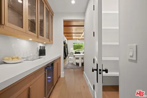 a kitchen with a refrigerator and a sink