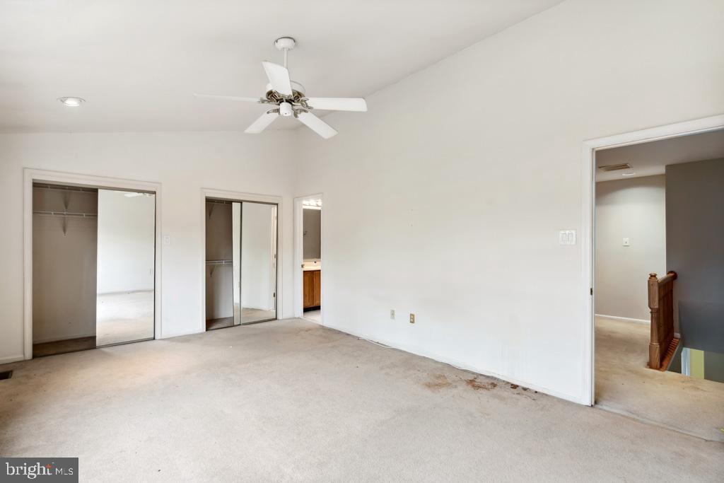5235 Lightfoot Path Columbia, MD 21044 - Photo 12 of 32 an empty room with chandelier fan and closet area