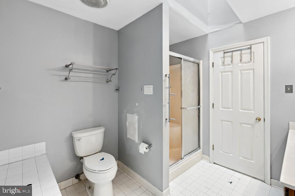 5235 Lightfoot Path Columbia, MD 21044 - Photo 14 of 32 a bathroom with a toilet and a shower