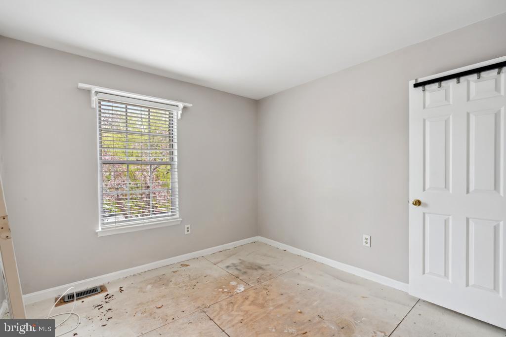 5235 Lightfoot Path Columbia, MD 21044 - Photo 17 of 32 an empty room with windows