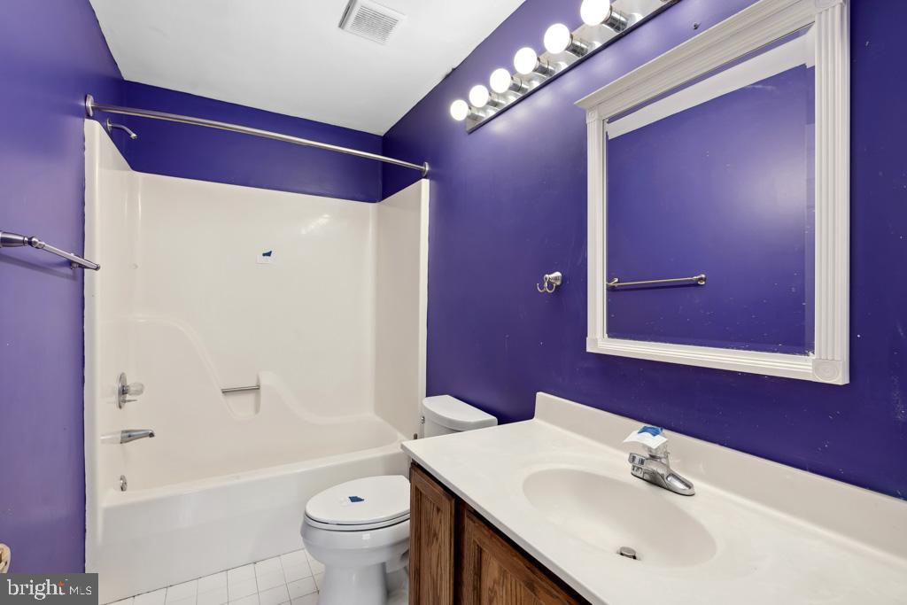 5235 Lightfoot Path Columbia, MD 21044 - Photo 18 of 32 a bathroom with a sink a toilet and shower