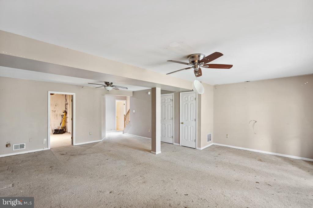 5235 Lightfoot Path Columbia, MD 21044 - Photo 26 of 32 a view of a livingroom with a ceiling fan and window