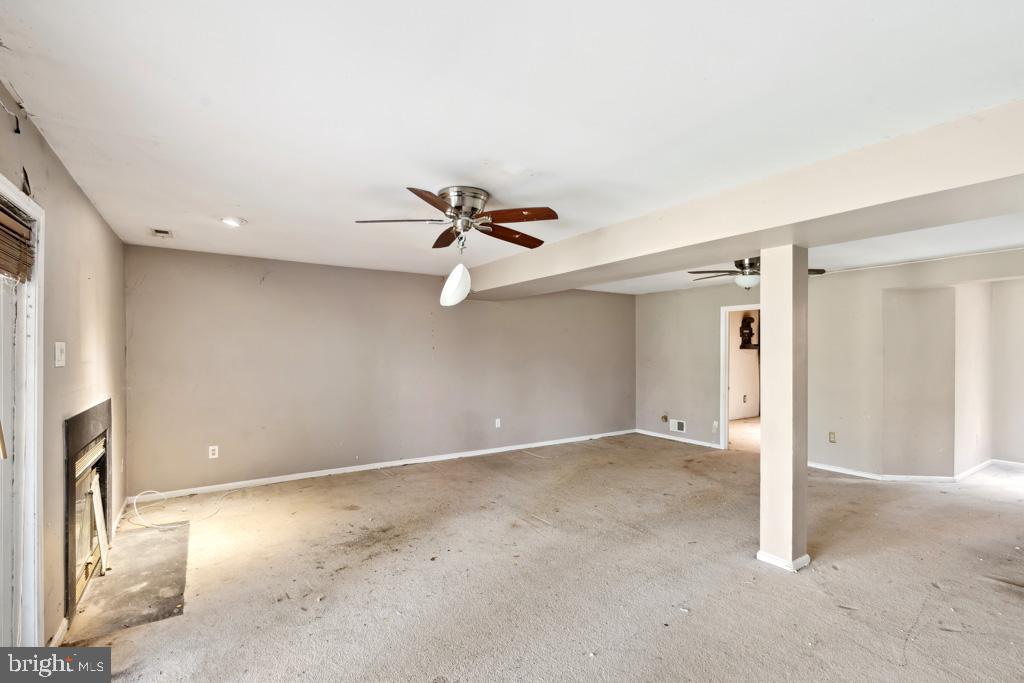 5235 Lightfoot Path Columbia, MD 21044 - Photo 27 of 32 a view of a livingroom with a ceiling fan and window