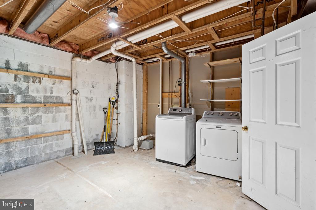 5235 Lightfoot Path Columbia, MD 21044 - Photo 28 of 32 a view of storage and utility room with washer and dryer