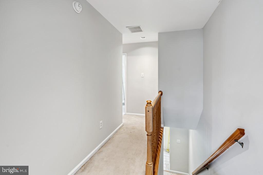 5235 Lightfoot Path Columbia, MD 21044 - Photo 9 of 32 a view of a livingroom with wooden floor