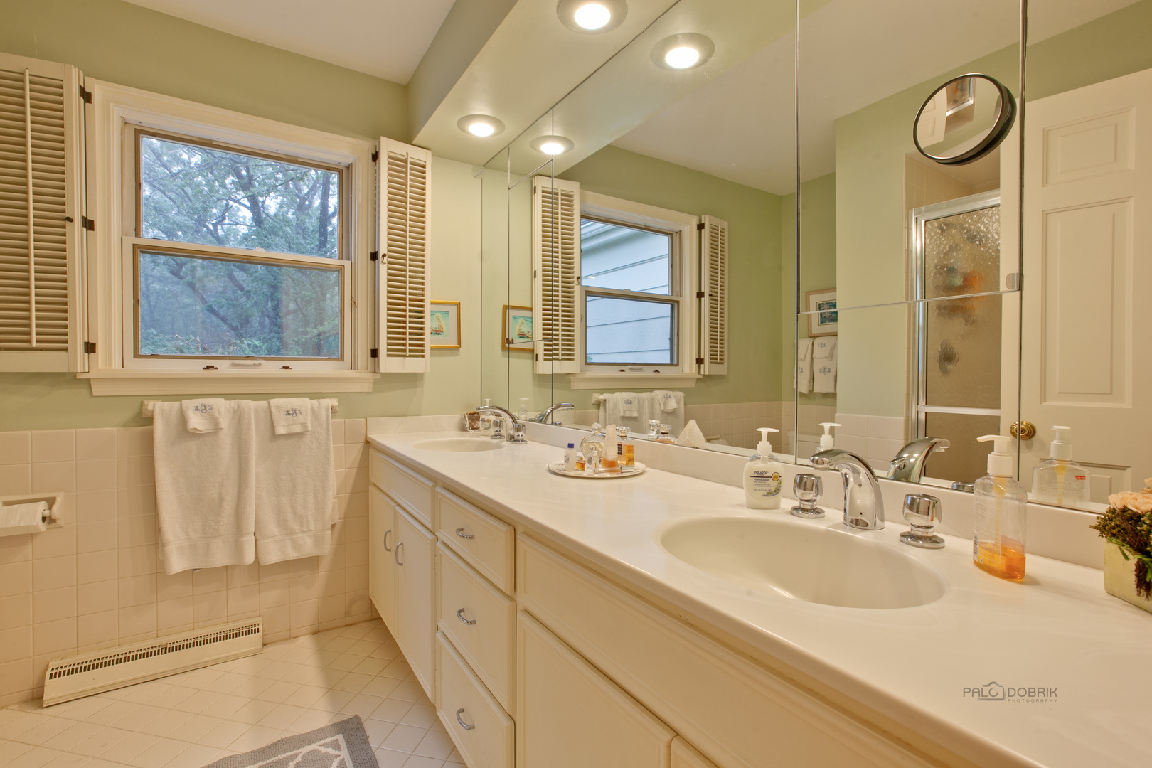 485 Rockefeller Road Lake Forest, IL 60045 - Photo 12 of 21 a bathroom with a double vanity sink and a mirror