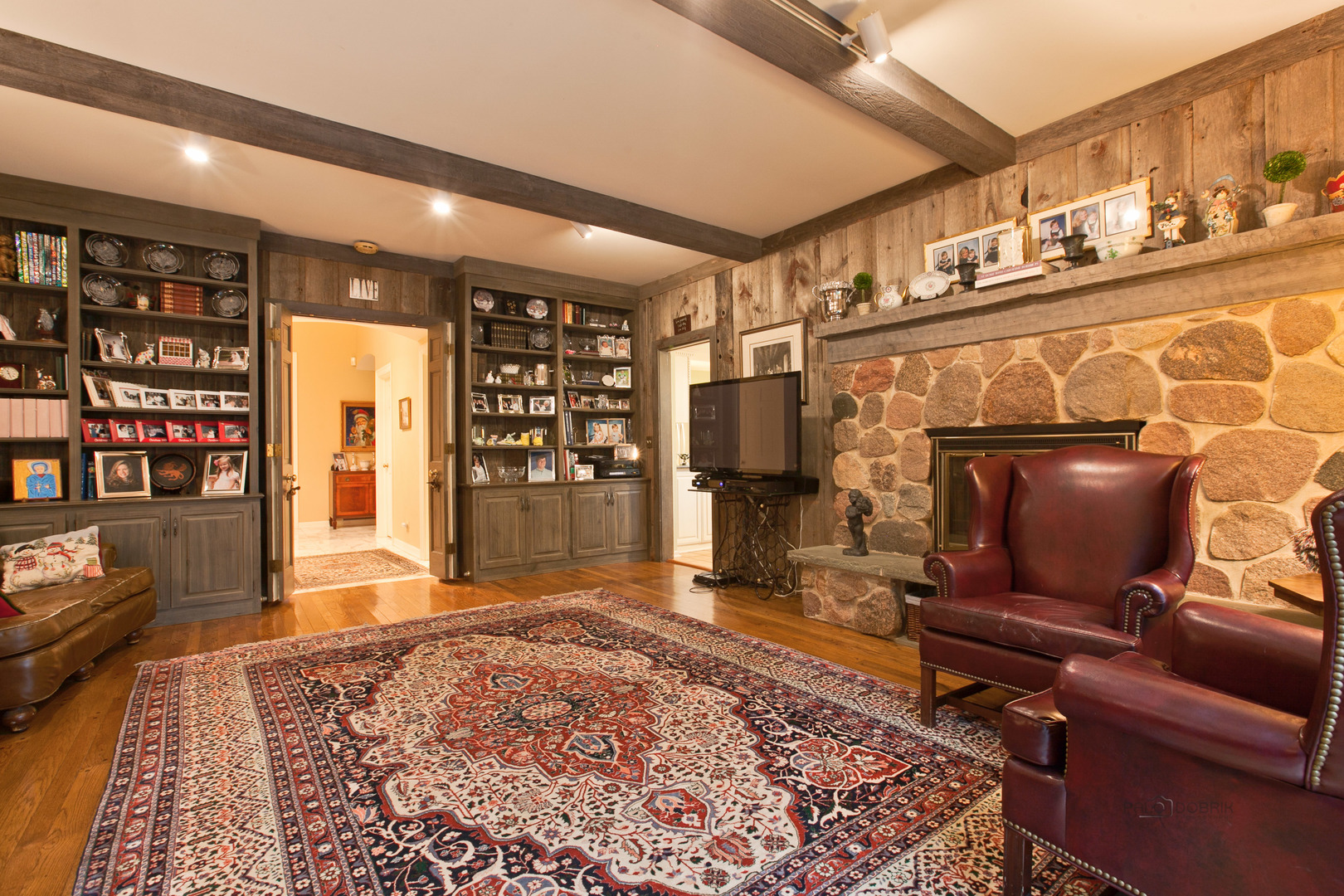 485 Rockefeller Road Lake Forest, IL 60045 - Photo 7 of 21 a living room with fireplace furniture and a rug