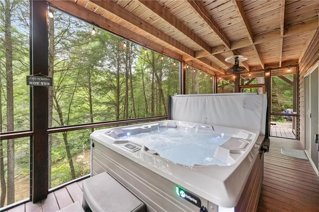 a view of a patio with table and chairs with wooden floor