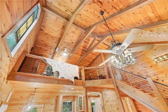 a bathroom with a granite countertop sink a toilet and a large mirror